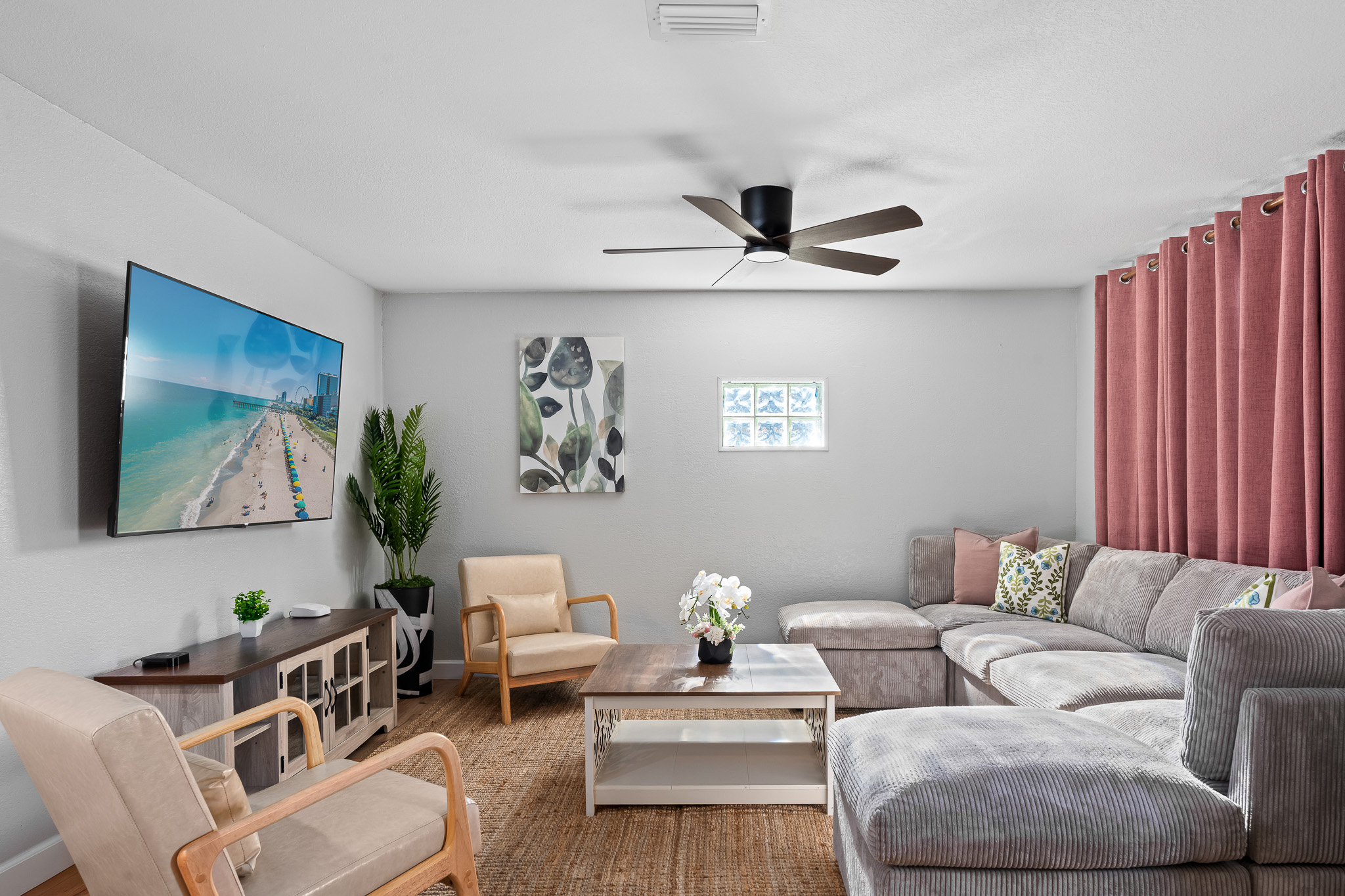 a living room with a couch and a fan, Cleaning By Aval: Frequently Asked Questions Explained